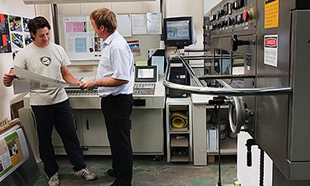 Photograph of commercial printing equipment.